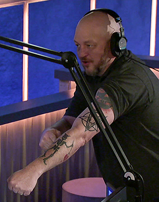 The Howard Stern Show  Ronnies tattoo That shark is either eating bones  or popping a zit on Ronnies bicep  Facebook