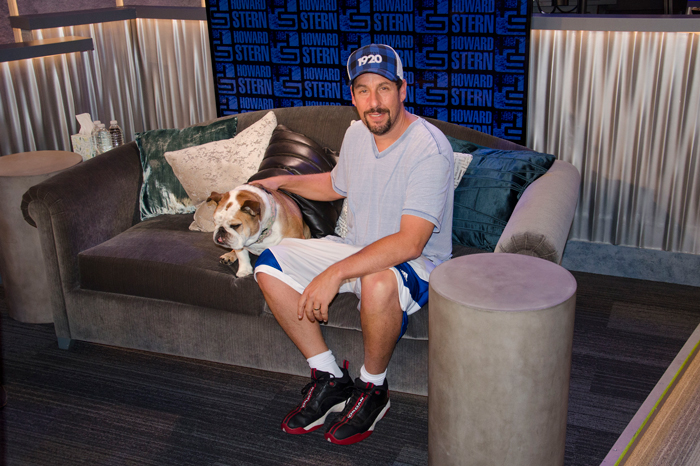 Adam Sandler on the Stern Show couch with his pet bulldog 