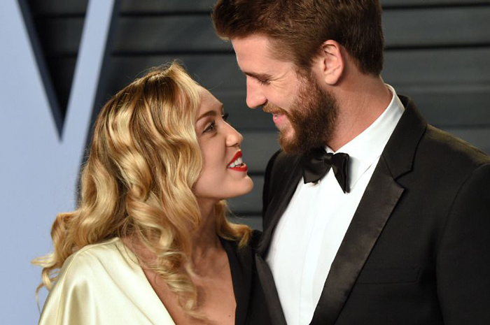 Miley Cyrus and Liam Hemsworth attend the 2018 Vanity Fair Oscar Party