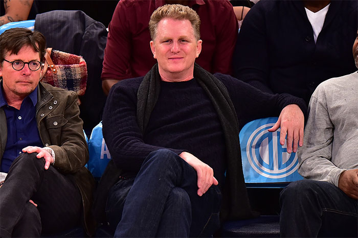 Michael J. Fox and Michael Rapaport sitting courtside at a New York Knicks game