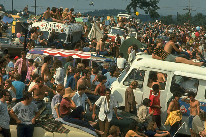 A large crowd of people watches the performances at Woodstock (1969)